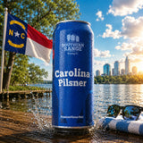 Carolina Pilsner craft lager can by a Carolina lake with the NC flag